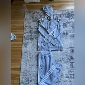 Grey Adidas Sweatsuit….. The pants have a small bleach stain on them.